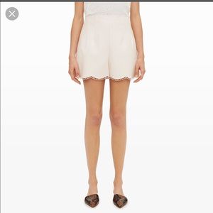 Club Monaco | faux leather shorts with scallop detail